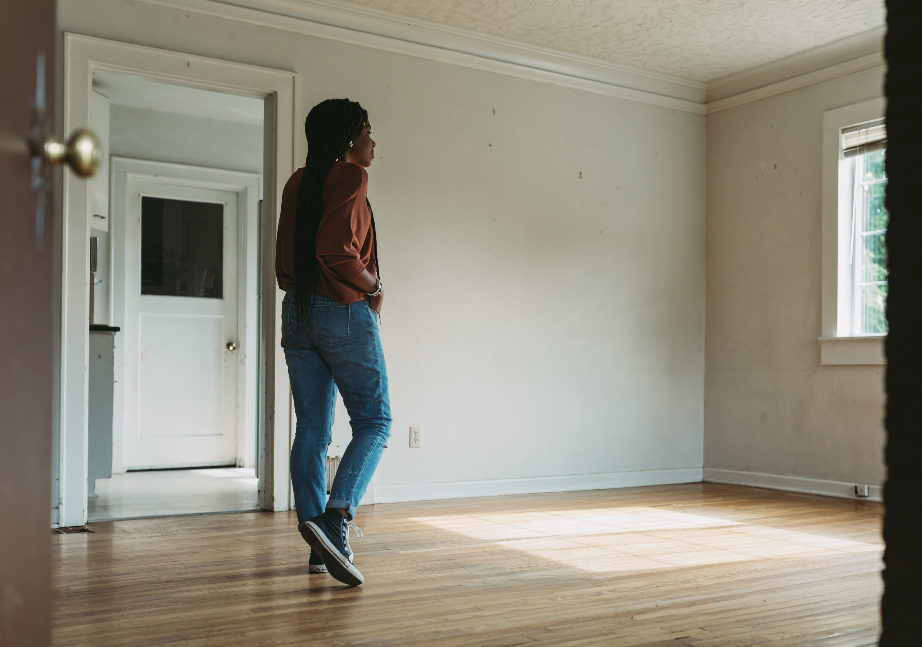 woman walking through empty house