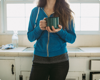 Homeowner holding a cup of tea